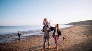 family walking on beach